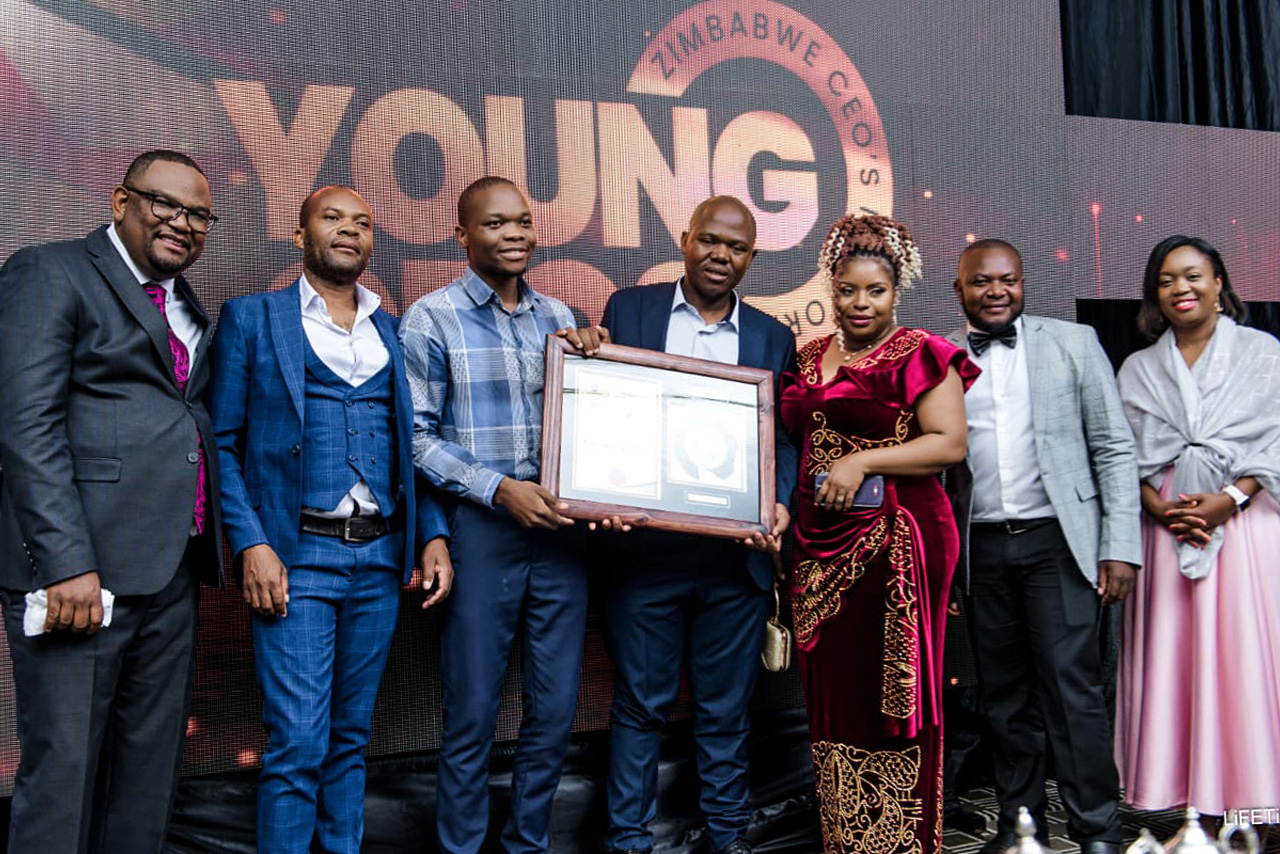 Alistar team and partners standing together at an industry award event